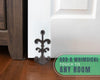 Fleur De Lis Cast Iron Door Stop – cast iron – side angle – Comfify