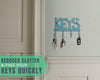 Cast Iron Key Holder – Decorative Farmhouse Wall Organizer with 4 Hooks, Screws & Anchors – detail close-up – Comfify