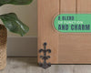 Fleur De Lis Cast Iron Door Stop – cast iron – scale comparison – Comfify
