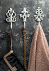 White decorative wall hooks with accessories